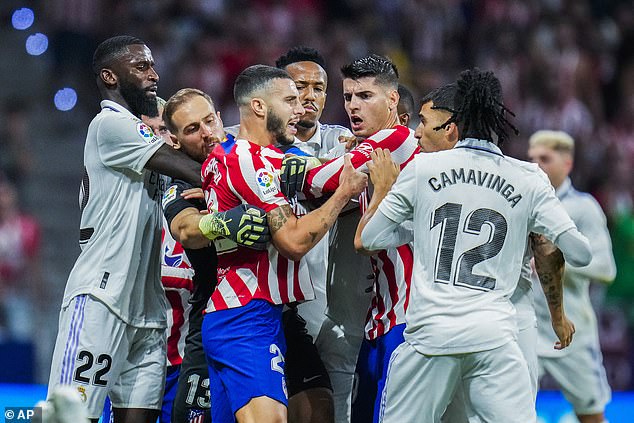 Atletico defender Hermoso (third left) was later sent off in a feisty and fiery Madrid derby